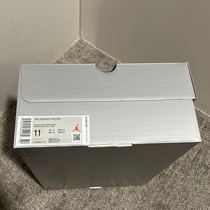 Never worn NWOT Air Jordan 13 Black and Purple Men Size 11. Flawless